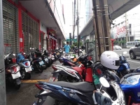 Scooters lined up outside the Post Office