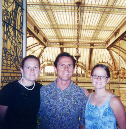 Mailea, Neil, Ari over looking garden room behind