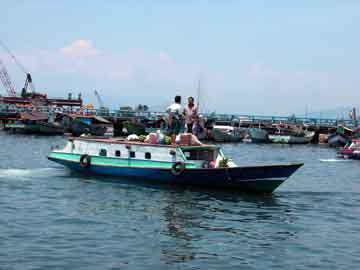 Bitung harbor ferry and market boat