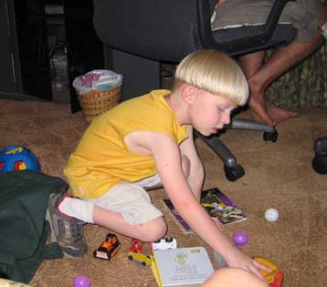 Playing with his toy bag