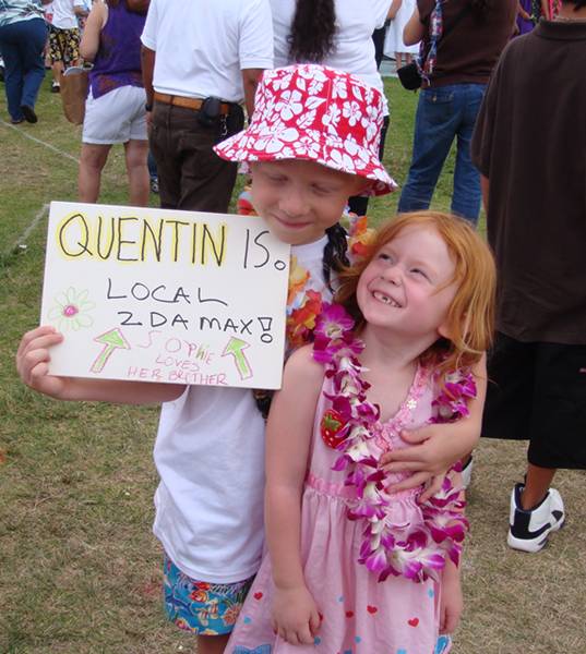 Sophie with sign for her brother