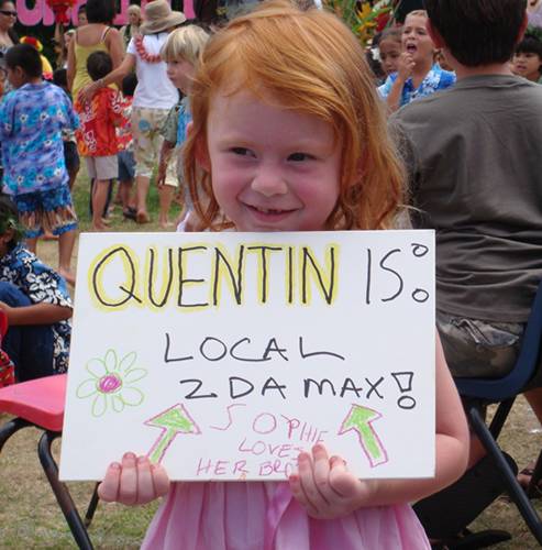 Sophie with sign for her brother