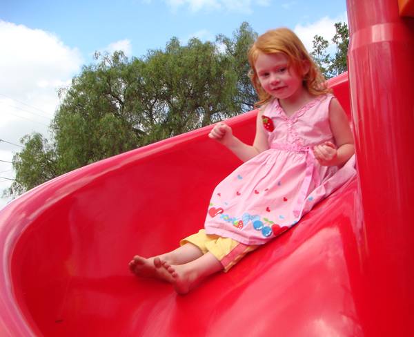 Sophie playing on the slide