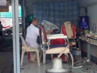 A barber waiting for customer