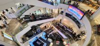 Multifloor Centralworld shopping center on a busy Saturday.