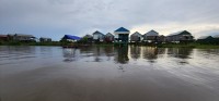 Sunlight reflection of houses on stilts